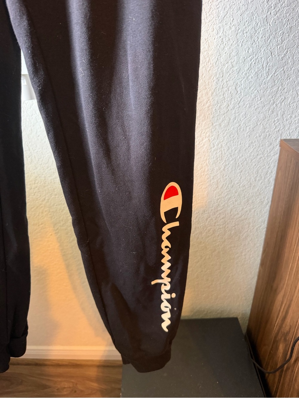 Champion Black Sweatpants with White Script and Red Emblem